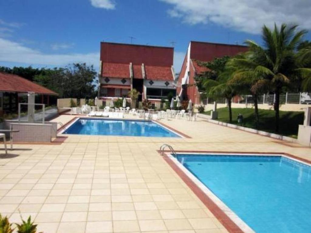 Πισίνα στο ή κοντά στο Village dos Pássaros Apartamento