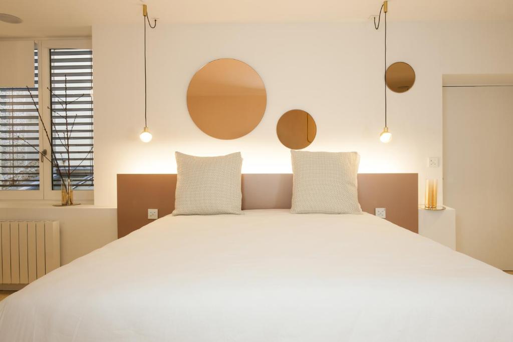 Postel nebo postele na pokoji v ubytování MiHotel Comte