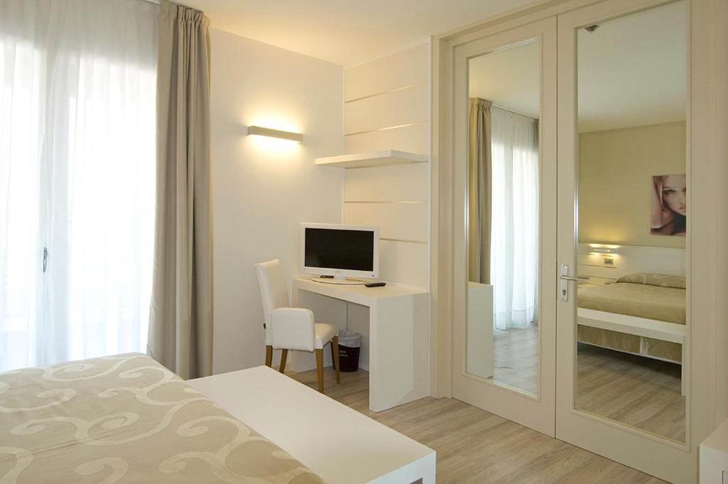 Posteľ alebo postele v izbe v ubytovaní Hotel Vienna
