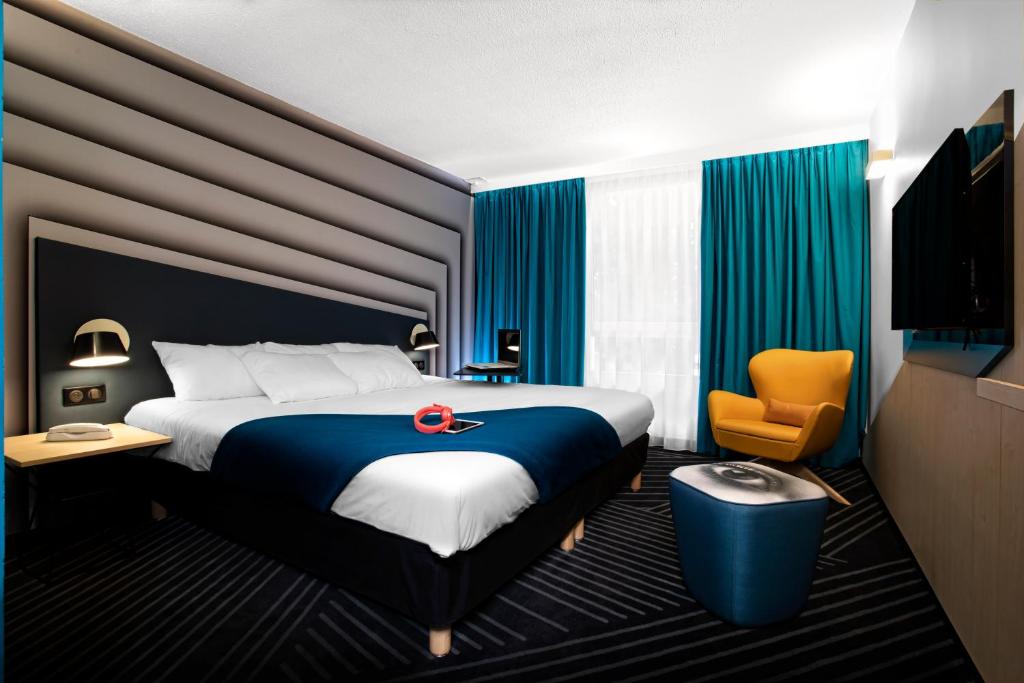 Postel nebo postele na pokoji v ubytování ibis Styles Avignon Sud