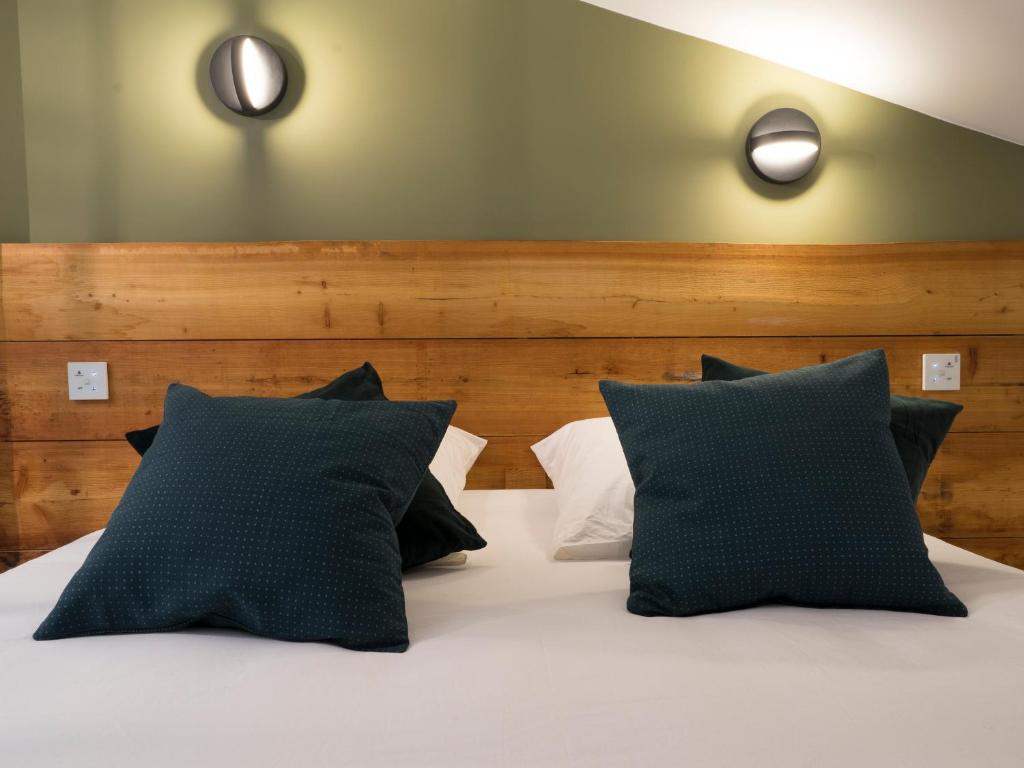 Postel nebo postele na pokoji v ubytování MiHotel Comte