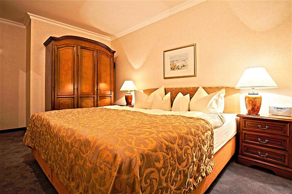 Postel nebo postele na pokoji v ubytování Hotel Am Rehberg