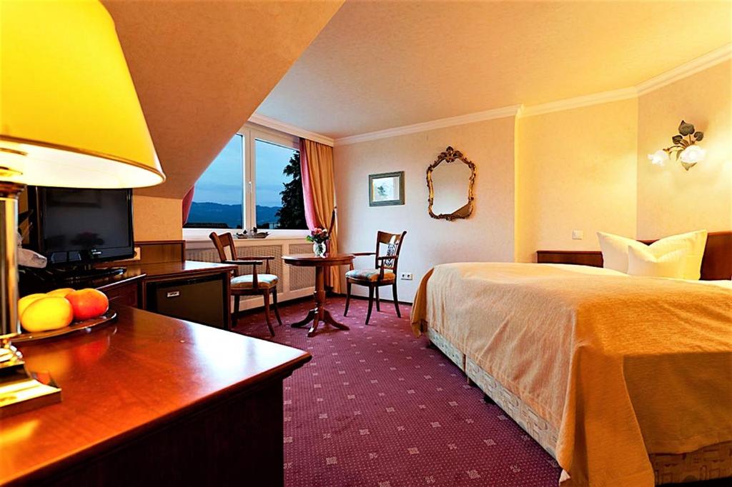 Postel nebo postele na pokoji v ubytování Hotel Am Rehberg