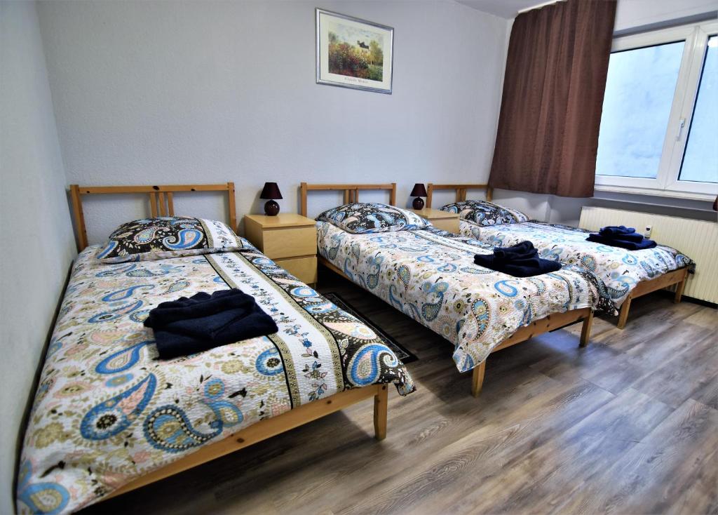 En eller flere senge i et værelse på Apartment Köln-Mülheim