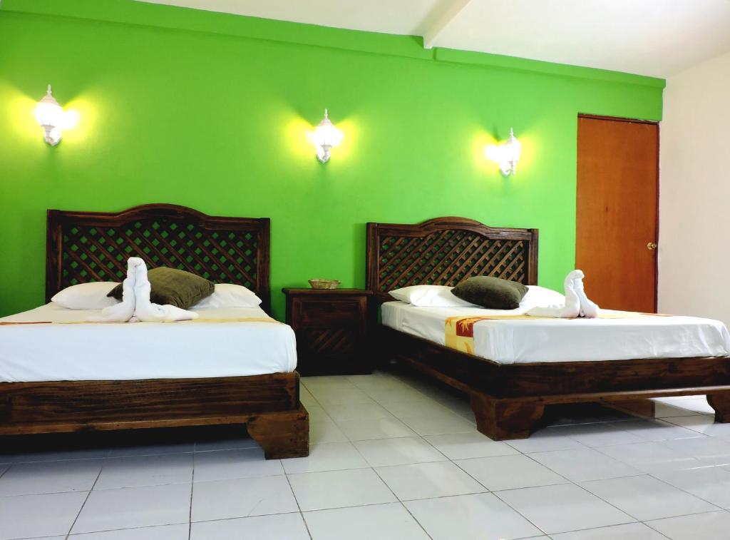 Postel nebo postele na pokoji v ubytování Hotel Valladolid
