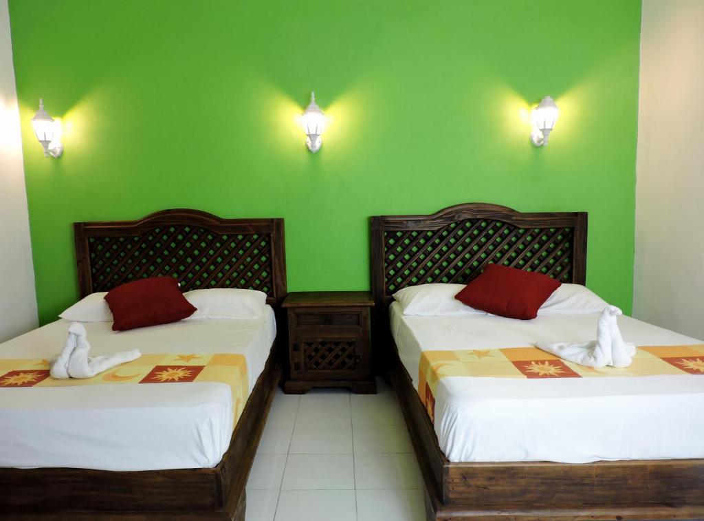Postel nebo postele na pokoji v ubytování Hotel Valladolid