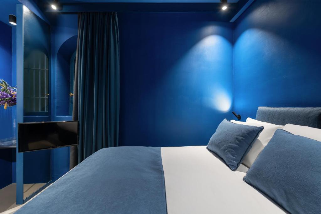 Posteľ alebo postele v izbe v ubytovaní Elysium Suites collection