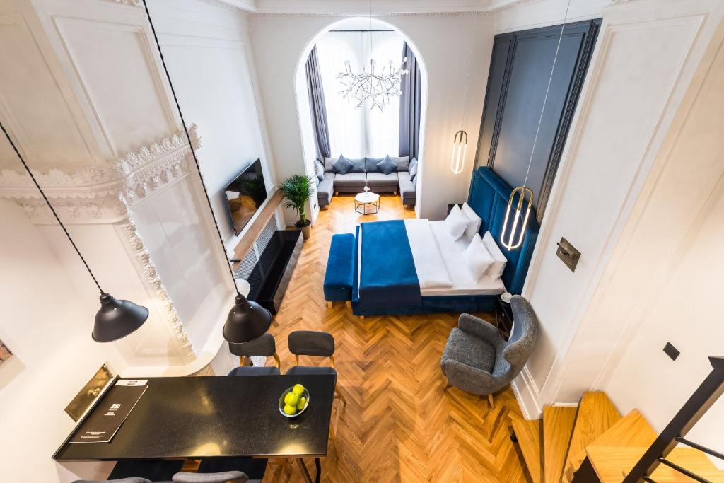 an aerial view of a living room with a bedroom at F12 Apartments in Saint Petersburg