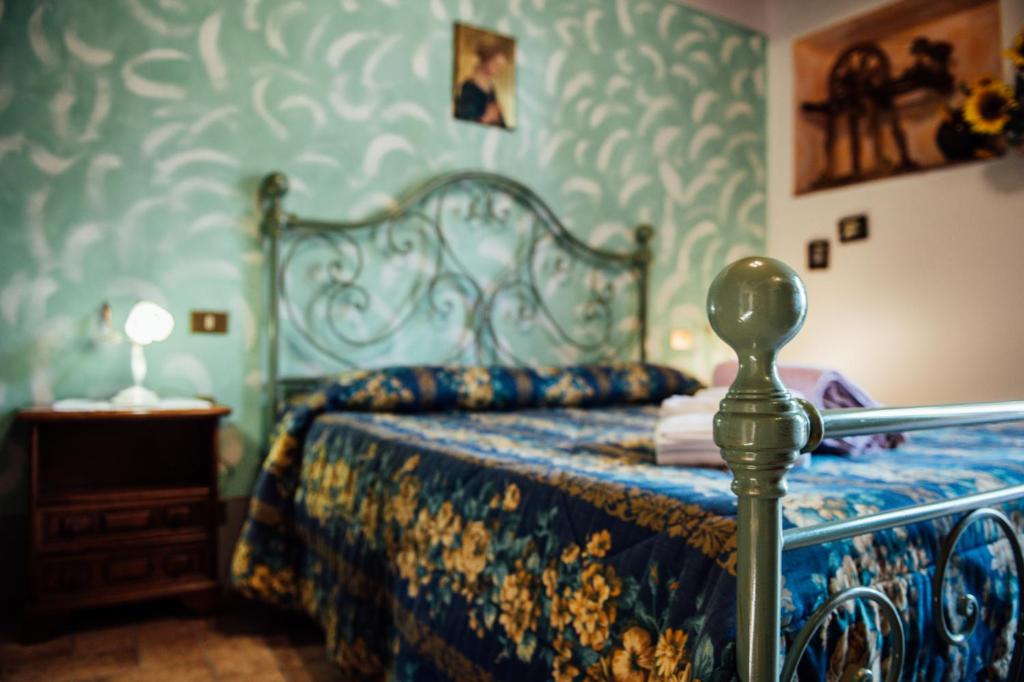 Posteľ alebo postele v izbe v ubytovaní Agriturismo Palazzo Conti A