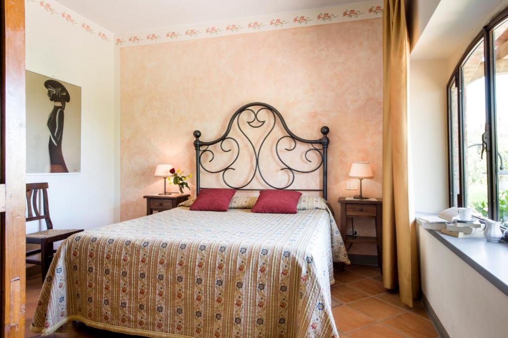 Postel nebo postele na pokoji v ubytování B&B Ponte a Nappo San Gimignano