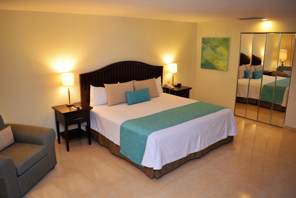 Postel nebo postele na pokoji v ubytování Astur Hotel & Residence