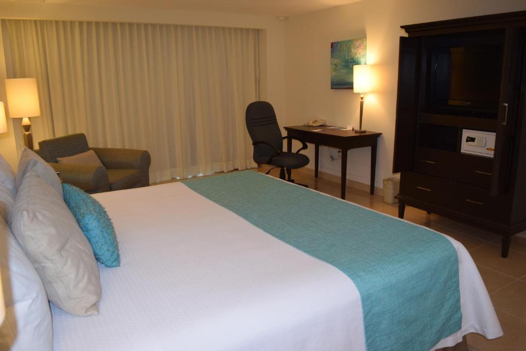 Postel nebo postele na pokoji v ubytování Astur Hotel & Residence