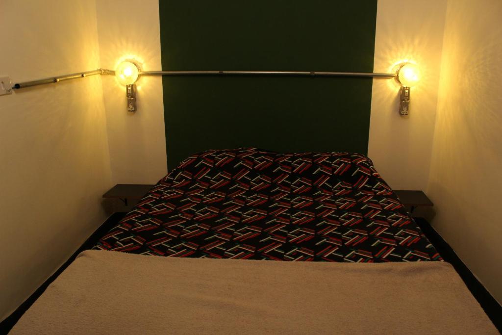 Postel nebo postele na pokoji v ubytování NeighborHUB hostel e coliving