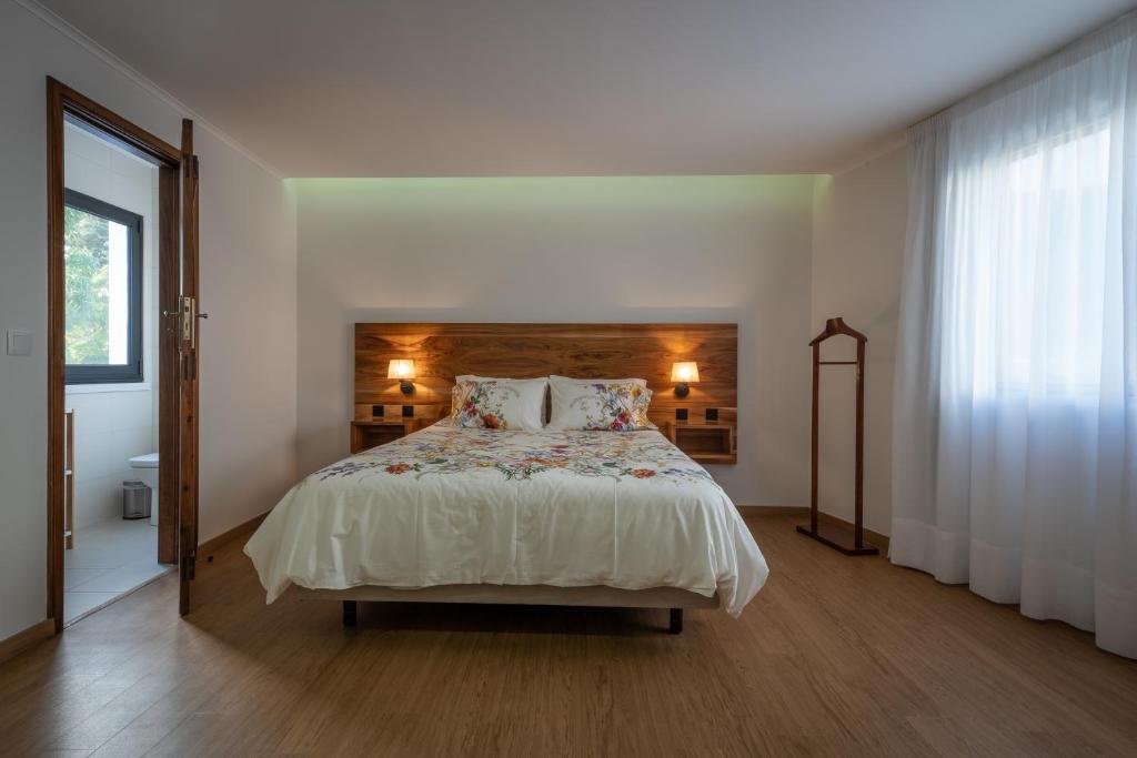 Postel nebo postele na pokoji v ubytování Palácio - Exclusive Villa, Caloura