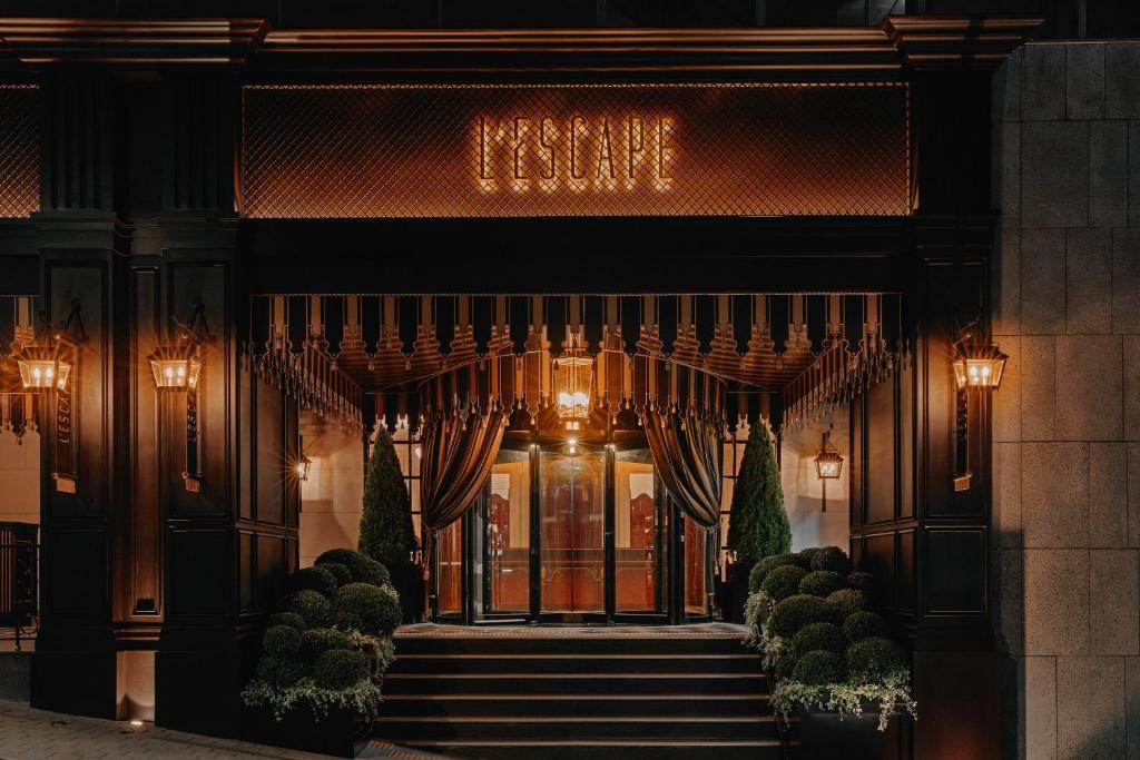 an entrance to a hotel with stairs leading to the front door at L'Escape Hotel in Seoul