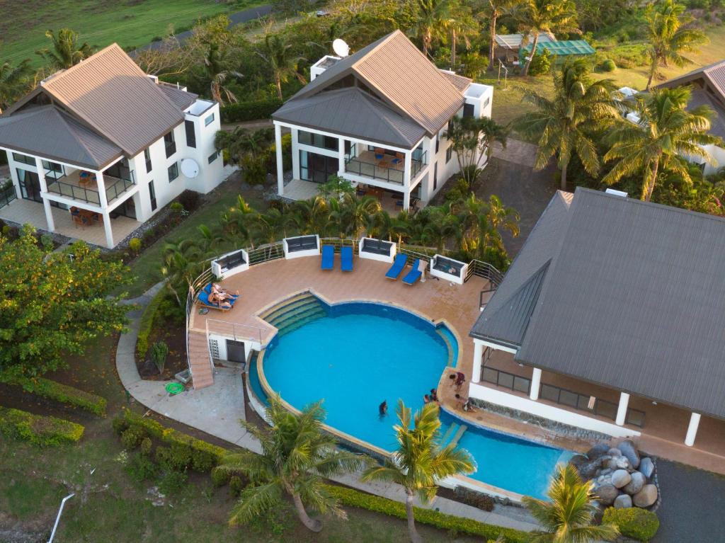 an aerial view of a house and a swimming pool at Dreamview Villas in Rakiraki