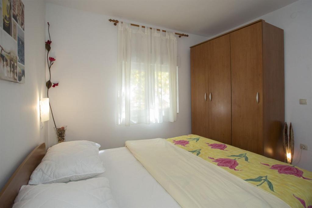 Postel nebo postele na pokoji v ubytování Apartments Gudelj