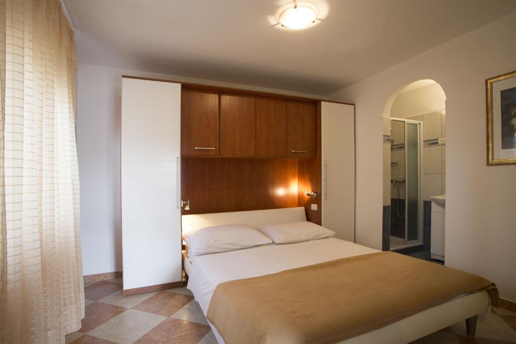 Postel nebo postele na pokoji v ubytování Apartments Gudelj