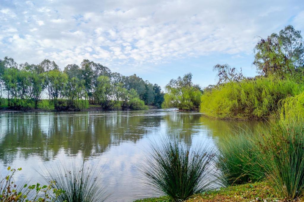 a river with trees and clouds in the sky at BIG4 Ingenia Holidays Wagga Wagga in Wagga Wagga