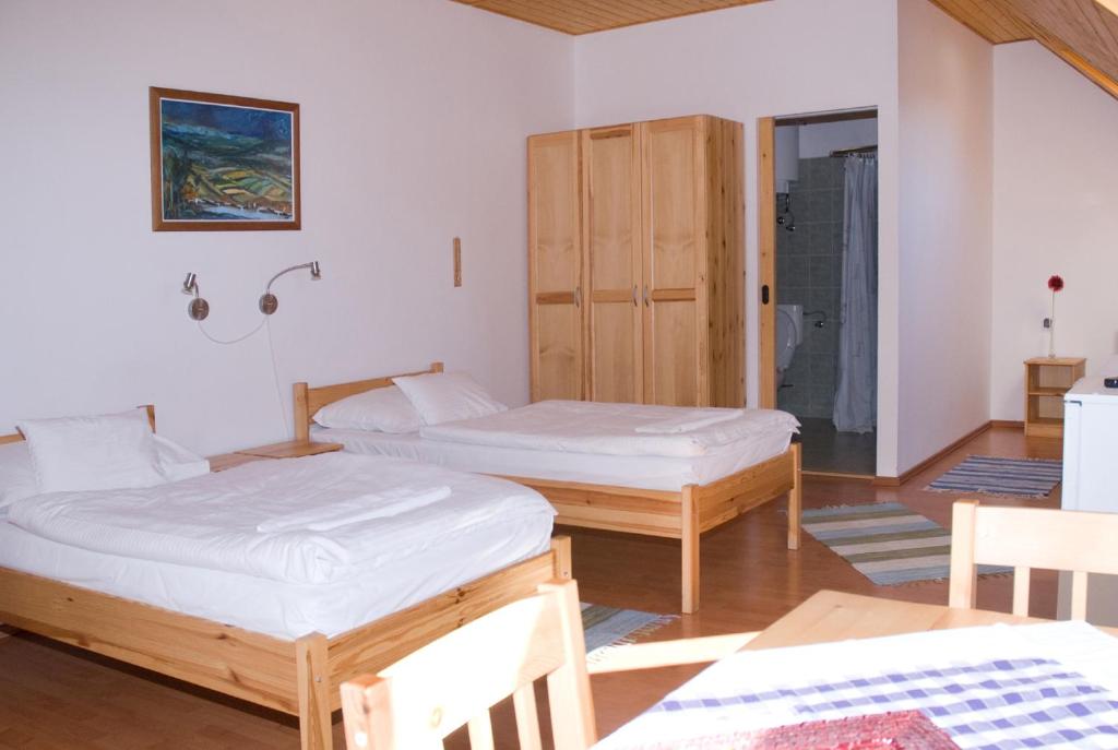 Postel nebo postele na pokoji v ubytování Haramia Csapszék és Fogadó