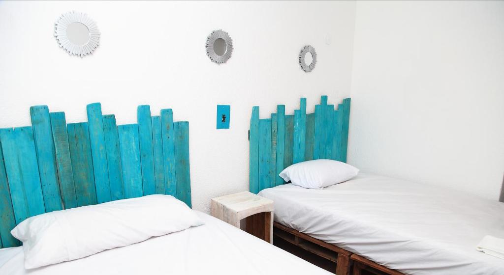 Postel nebo postele na pokoji v ubytování Casa Cálido Hotel
