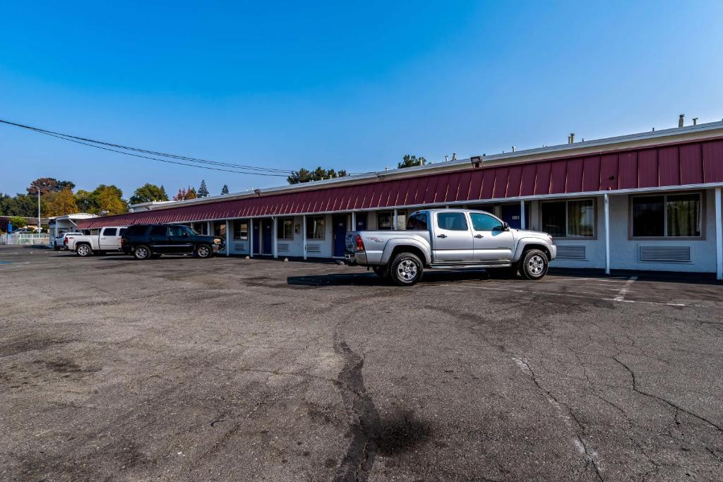 a truck parked in a parking lot in front of a building at Motel 6-Concord, CA in Concord