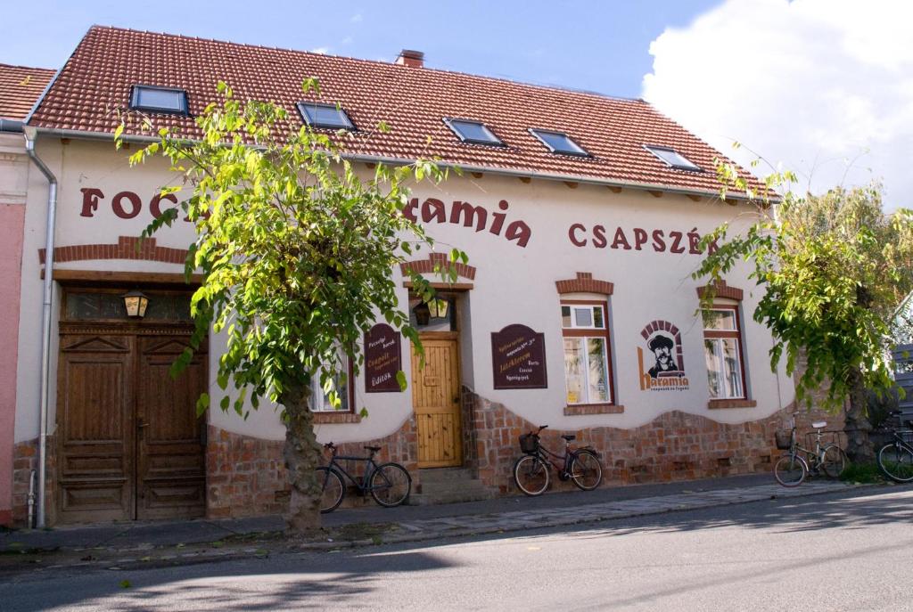 a building with bikes parked outside of it at Haramia Csapszék és Fogadó in Szombathely