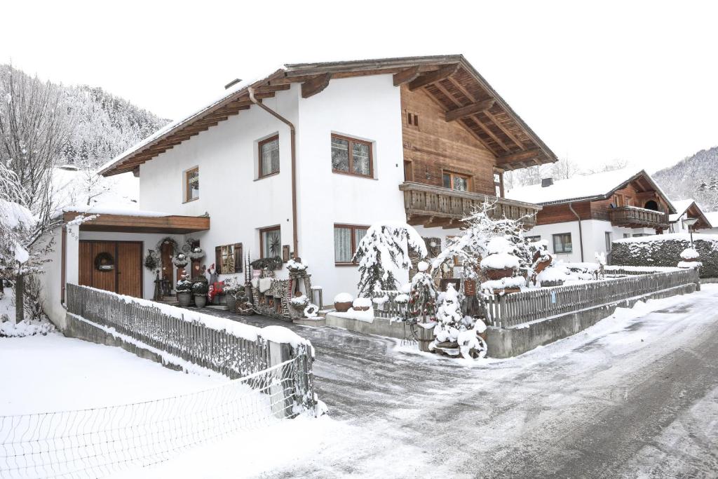 a house covered in snow in front at Haus Lutt in Ried im Oberinntal