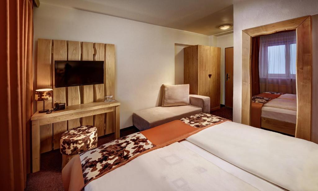 Postel nebo postele na pokoji v ubytování Hotel Srdiečko