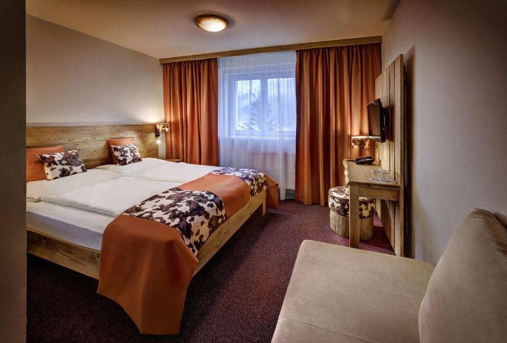 Postel nebo postele na pokoji v ubytování Hotel Srdiečko