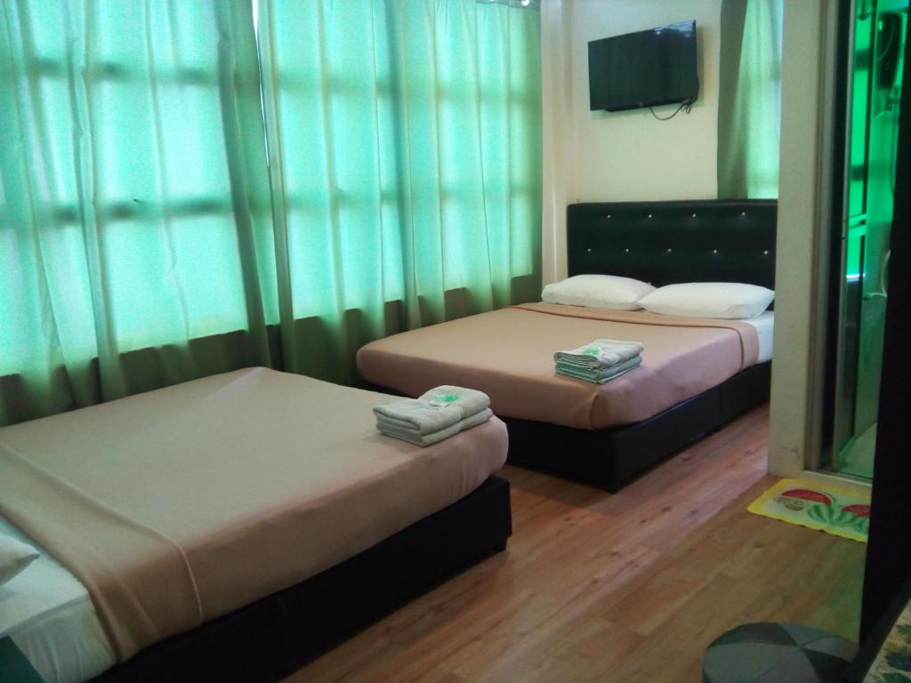 Postel nebo postele na pokoji v ubytování BINKHALED HOTEL