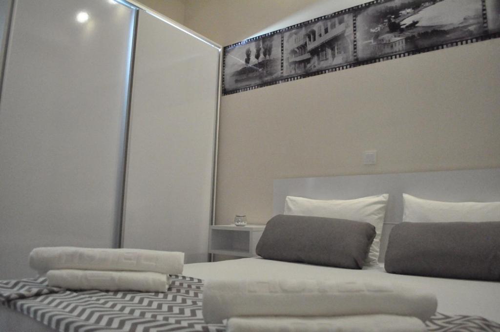 Postel nebo postele na pokoji v ubytování Comfort Deluxe Kosmos Apartments