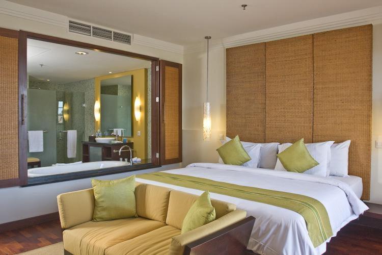 a large bedroom with a large bed and a couch at Apartment Nusa Dua in Nusa Dua
