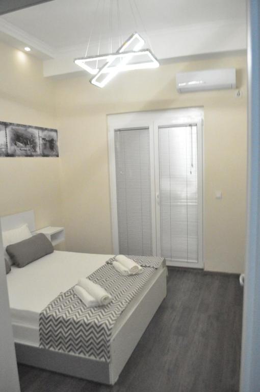 Postel nebo postele na pokoji v ubytování Comfort Deluxe Kosmos Apartments