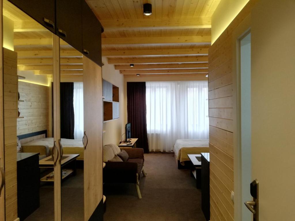 Postel nebo postele na pokoji v ubytování Room225 - New Gudauri Suites