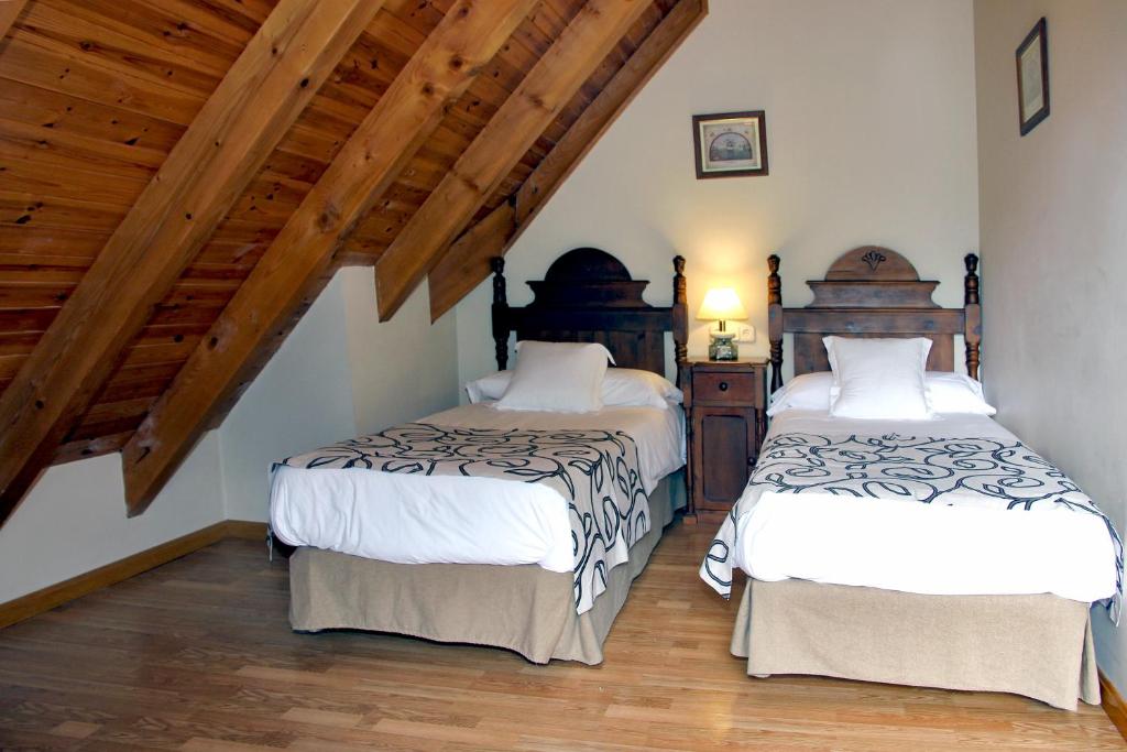 Postel nebo postele na pokoji v ubytování Apartamentos Deth Camin Reiau