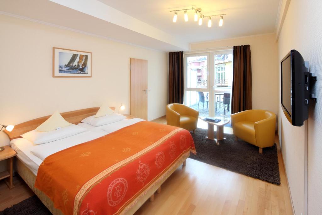 Postel nebo postele na pokoji v ubytování Hotel Am Segelhafen
