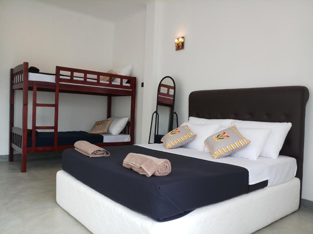 Postel nebo postele na pokoji v ubytování Blossom Inn