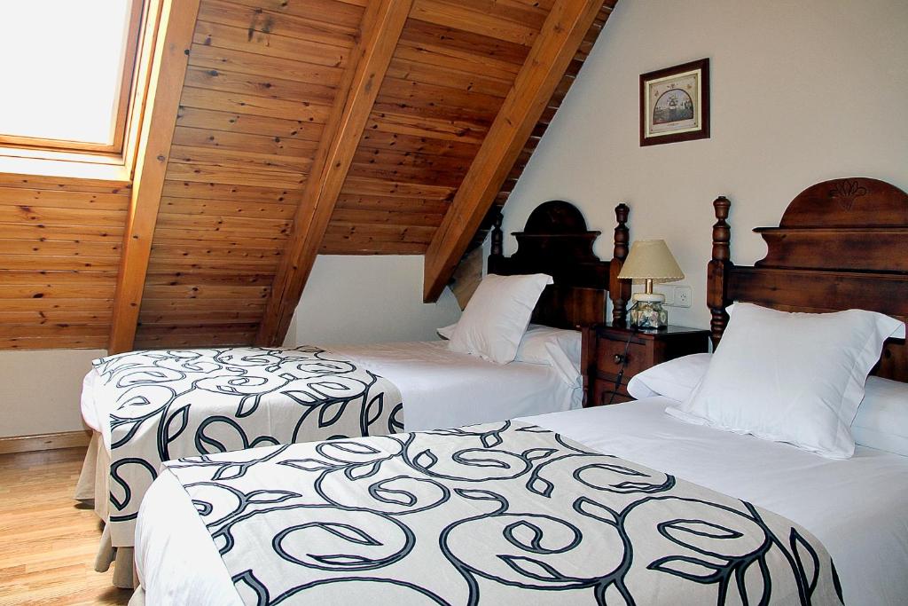Postel nebo postele na pokoji v ubytování Apartamentos Deth Camin Reiau