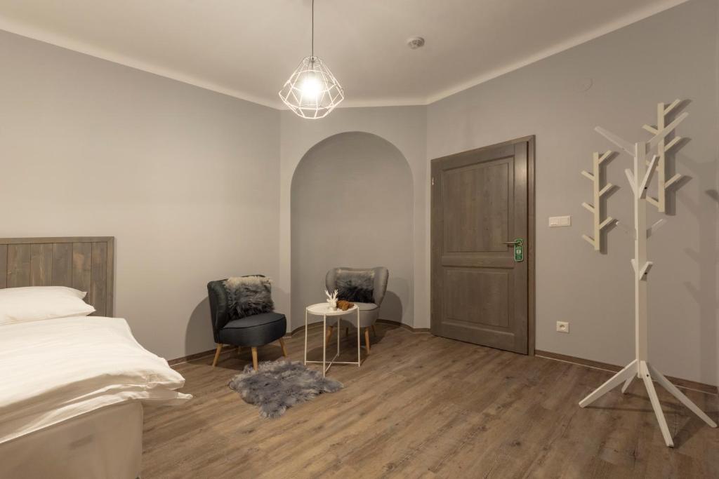 Postel nebo postele na pokoji v ubytování Hotel pod Kapličkou