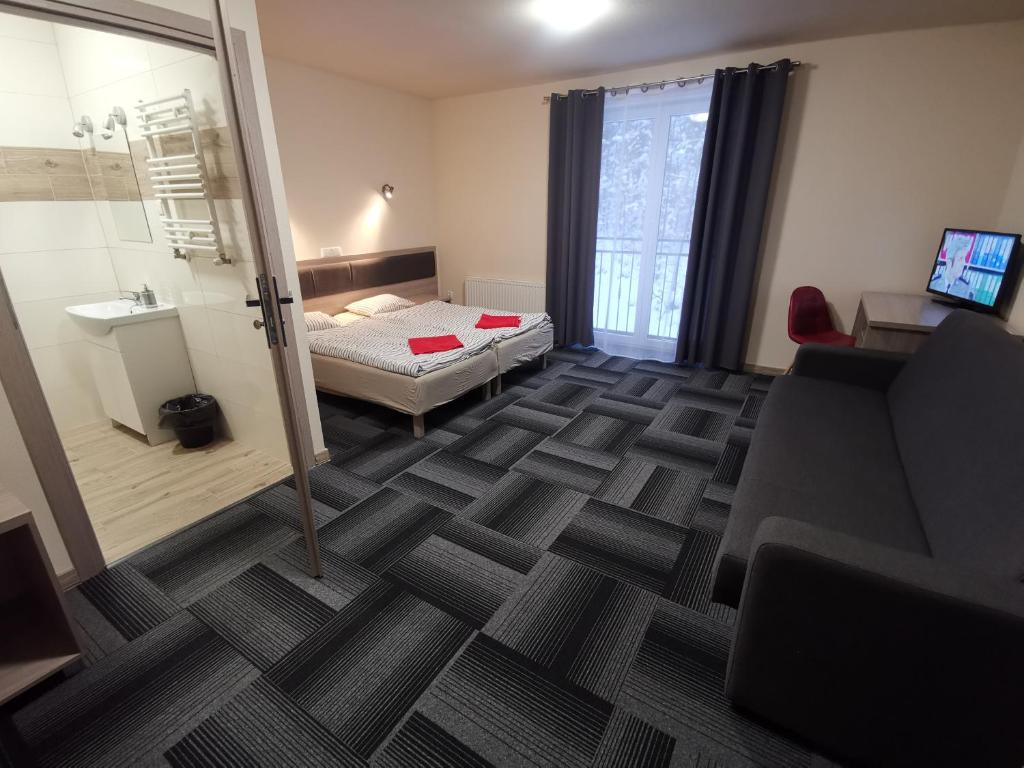 Posteľ alebo postele v izbe v ubytovaní dask resort