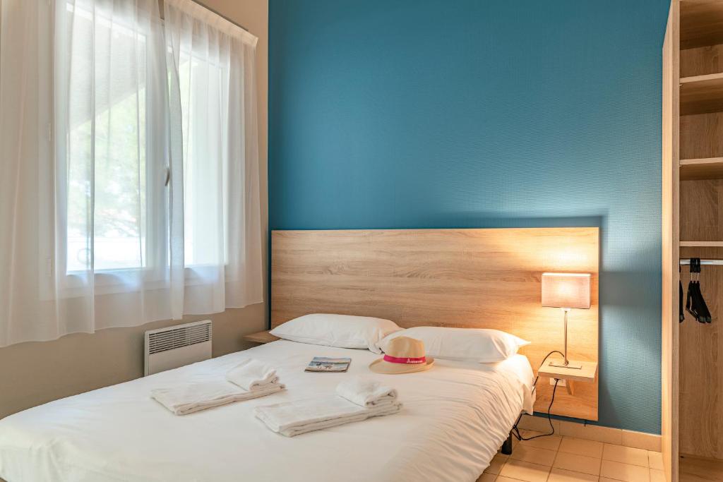 Postel nebo postele na pokoji v ubytování Azureva Ile d'Oleron