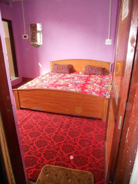 Postel nebo postele na pokoji v ubytování Alamdar guest house