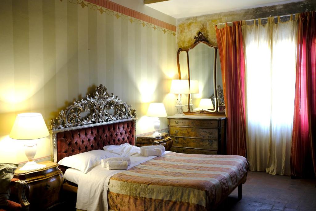 Postel nebo postele na pokoji v ubytování Al Tuscany