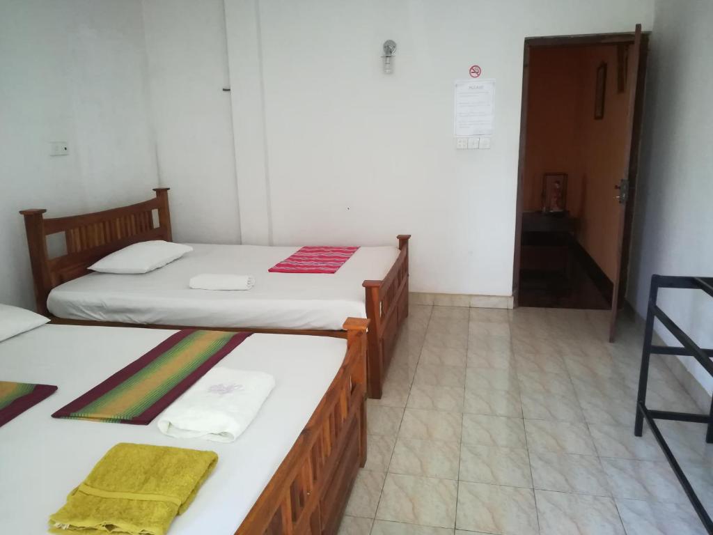 Postel nebo postele na pokoji v ubytování Kandy Hill Escape