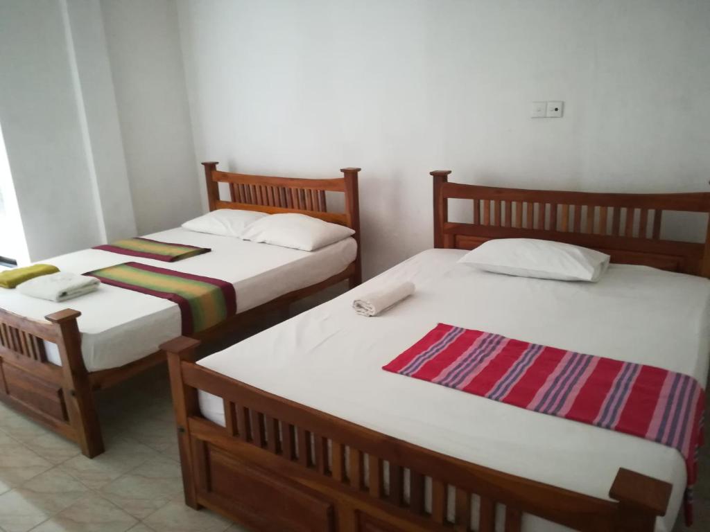 Postel nebo postele na pokoji v ubytování Kandy Hill Escape