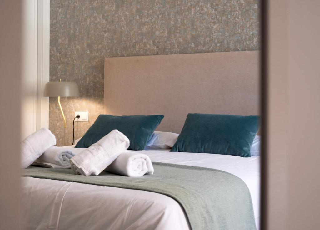 Postel nebo postele na pokoji v ubytování MALAGUETA SEA VIEW - PREMIUM APARTMENT