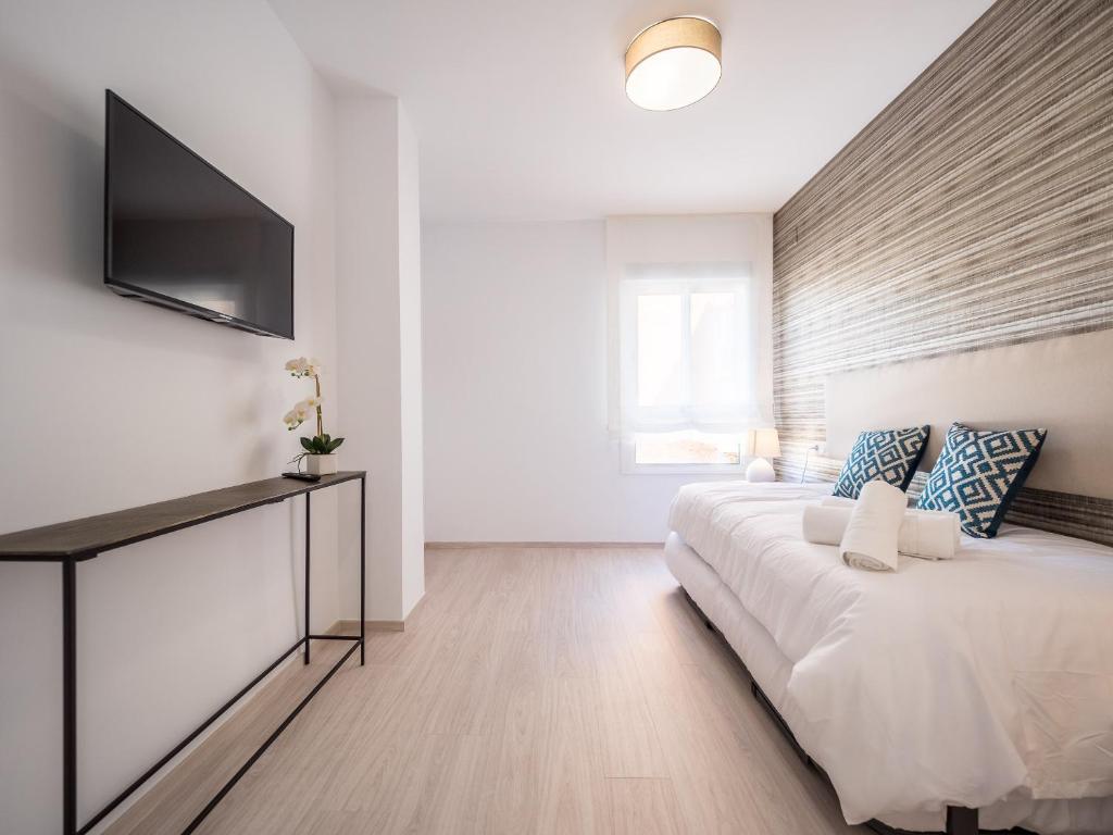 Postel nebo postele na pokoji v ubytování MALAGUETA SEA VIEW - PREMIUM APARTMENT