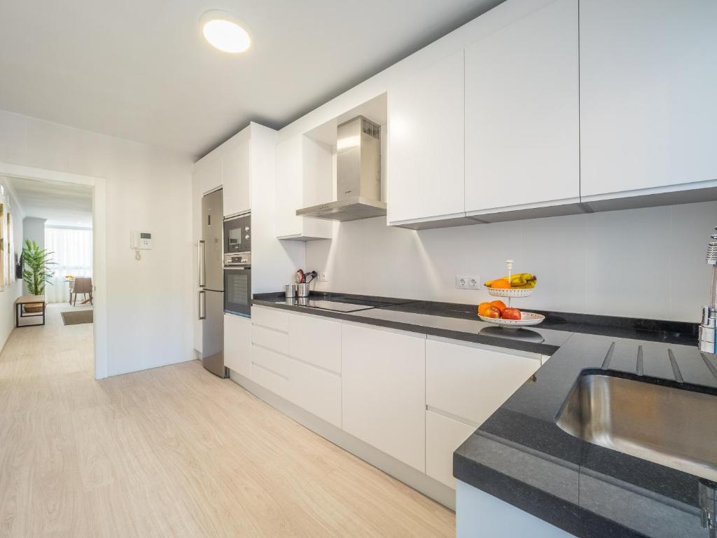 Kuchyň nebo kuchyňský kout v ubytování MALAGUETA SEA VIEW - PREMIUM APARTMENT