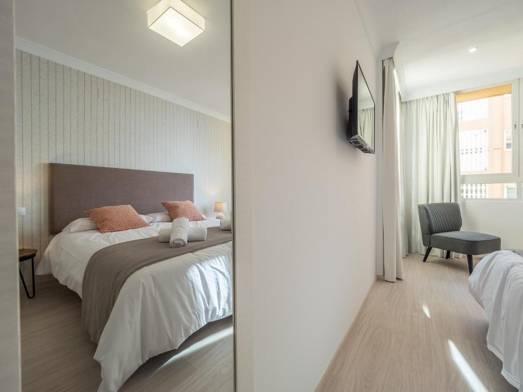 Postel nebo postele na pokoji v ubytování MALAGUETA SEA VIEW - PREMIUM APARTMENT